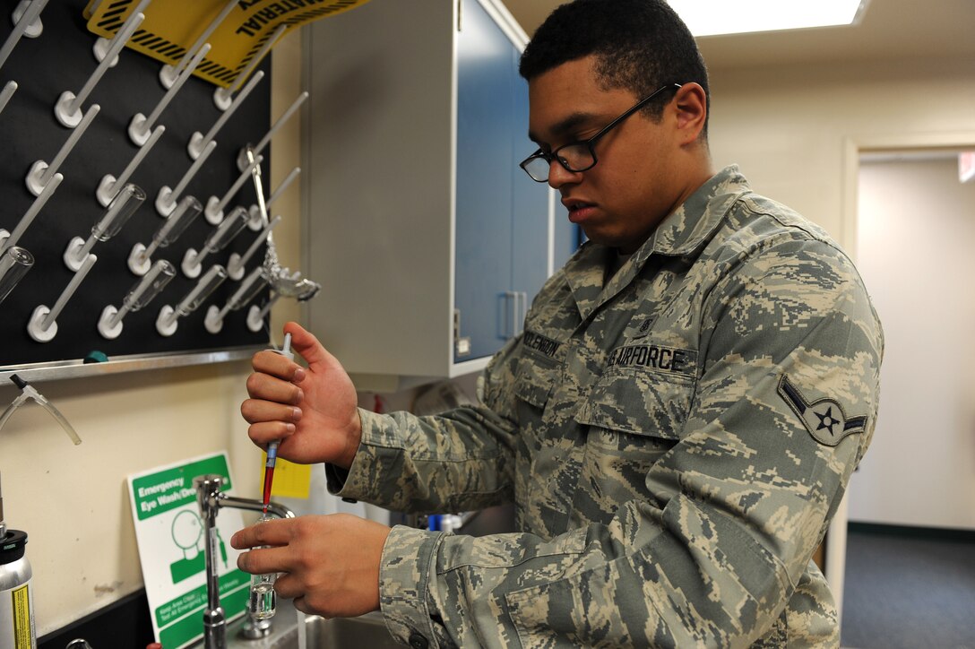U.S Air Force Airman Alex McClendon, 633rd Aerospace Medicine Squadron bioenvironmental engineer technician, tests a water sample at Langley Air Force Base, Va., Feb. 9, 2016. Routine water samples are taken from various facilities across the base testing for chlorine, potential hydrogen and bacteriological matter in the water. (U.S. Air Force photo by Senior Airman Brittany E. N. Murphy)