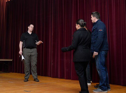 U.S. Air Force Airmen act out a skit Feb. 9, 2016, in the base theater on RAF Mildenhall, England. The Sexual Assault Prevention and Response office held a training seminar to inform Airmen around base about the new “#SaySomething: Bystander Intervention Initiative.” During the training, two skits were conducted to relay the importance of intervening during inappropriate situations or behavior.  (U.S. Air Force photo by Staff Sgt. Micaiah Anthony/Released)
