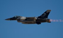 An F-16C Fighting Falcon from the 64th Aggressor Squadron flies over Nellis AFB, Nev., during Red Flag 16-1, Feb. 5, 2016. More than 30 squadrons work together against these high level advisories as they would in the field. (U.S. Air Force photo by Senior Airman Alex Fox Echols III/Released)  
