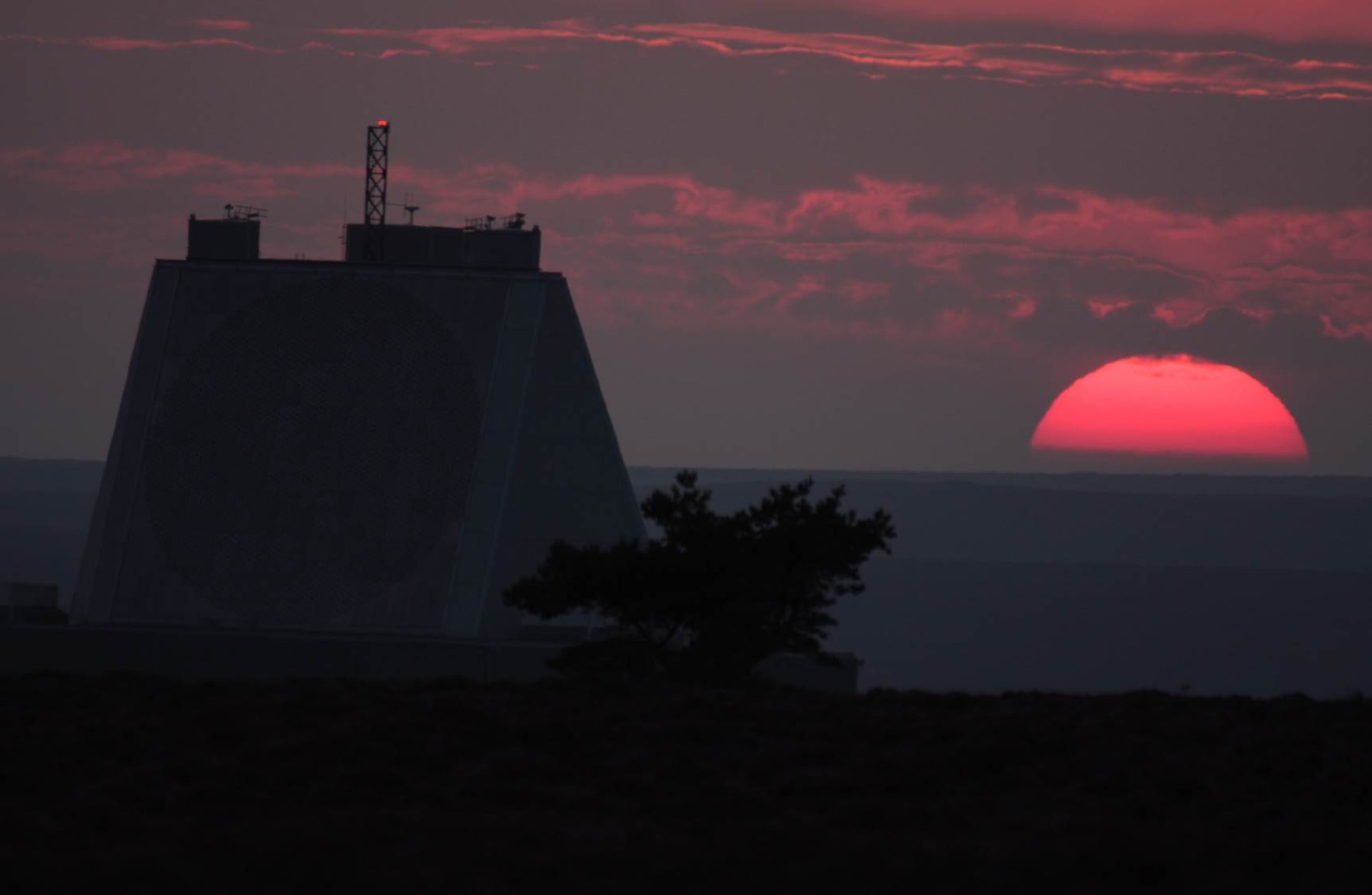 ROYAL AIR FORCE FYLINGDALES, U.K. – The sun sets upon the Upgrade Early Warning System solid state array at RAF Fylingdales near the North Sea town of Whitby in England. The day is not done for those who monitor space however, which takes place around the clock. (Courtesy photo)