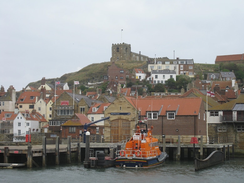 WHITBY, NORTH YORKSHIRE, England – The Whitby harbor. The church on the hill is in front of the legendary Whitby Abbey, where Brahm Stoker took inspiration for his fictional character Dracula. The steps leading up to the hill are the famed 199 stairs where the infamous vampire died. (Courtesy photo)