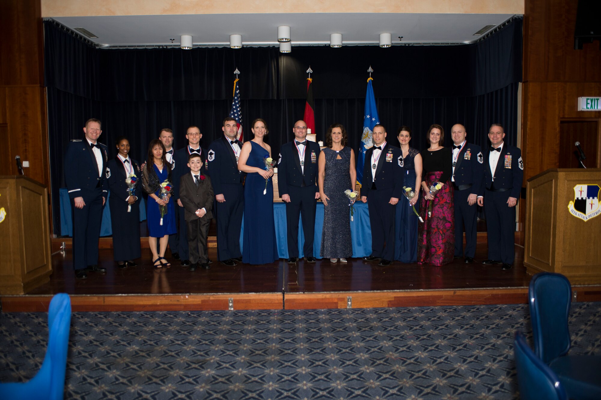 U.S. Air Force Col. Joe McFall, 52nd Fighter Wing commander, left,  and Chief Master Sgt. Brian Gates, 52nd FW command chief, right, pose with Spangdahlem Air Base's newest chief master sergeants selected for promotion and their families during an induction banquet at Club Eifel at Spangdahlem Air Base, Germany, Feb. 12, 2016. Chief master sergeants represent the top one percent of the enlisted force structure, as mandated by the U.S. Congress. (U.S. Air Force photo by Staff Sgt. Joe W. McFadden / Released)
