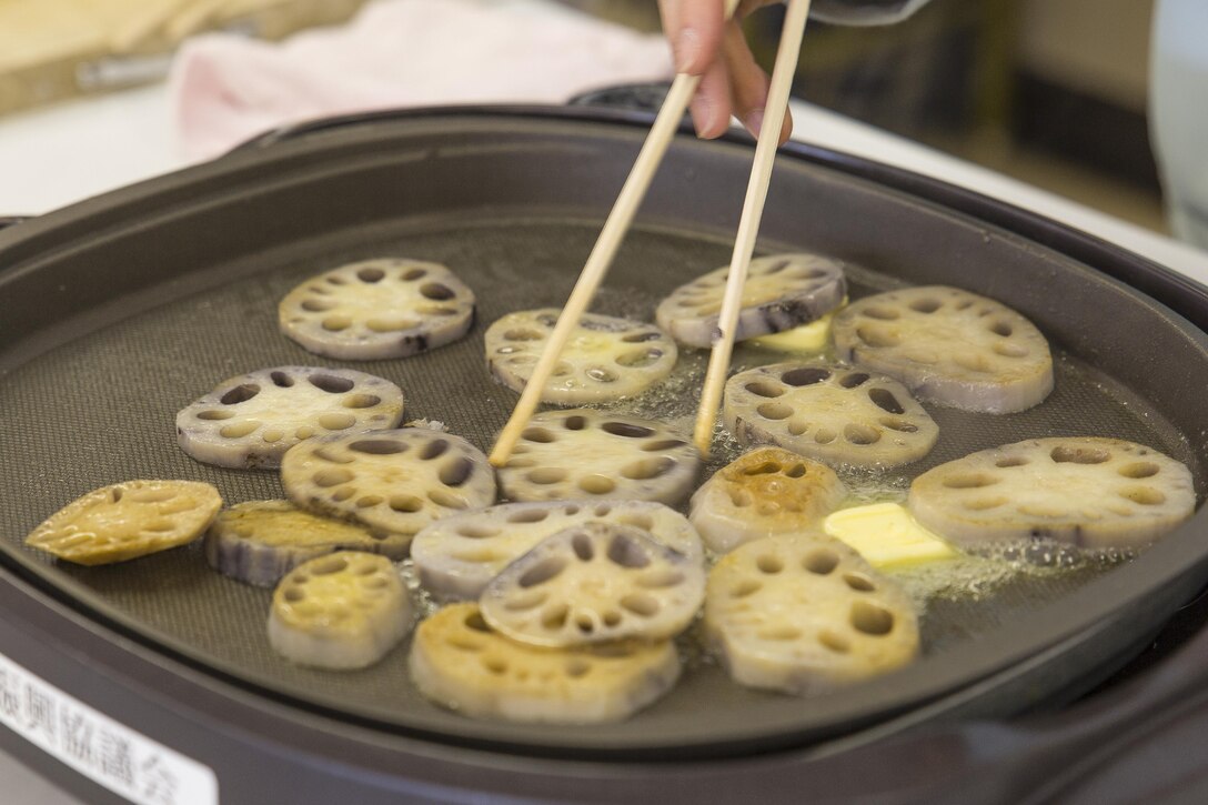 Residents from Marine Corps Air Station Iwakuni learned how to cook lotus roots during a cultural adaptation program in Iwakuni City, Japan, Feb. 10, 2016. Japanese workers from Yamaguchi’s Agricultural, Forestry, Fisheries, and? Stockbreeding provided residents information on lotus roots and different ways they can cook them. Lotus roots, also known as renkon, are vegetables and are considered a food of good omen.