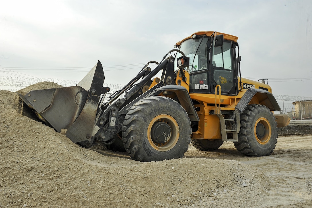 Air Force Staff Sgt. Richard Bonham operates heavy equipment while building the foundation for a new road on Bagram Airfield, Afghanistan, Feb. 9, 2016. Bonham is assigned to the 455th Expeditionary Civil Engineers Squadron. Air Force photo by Tech. Sgt. Nicholas Rau