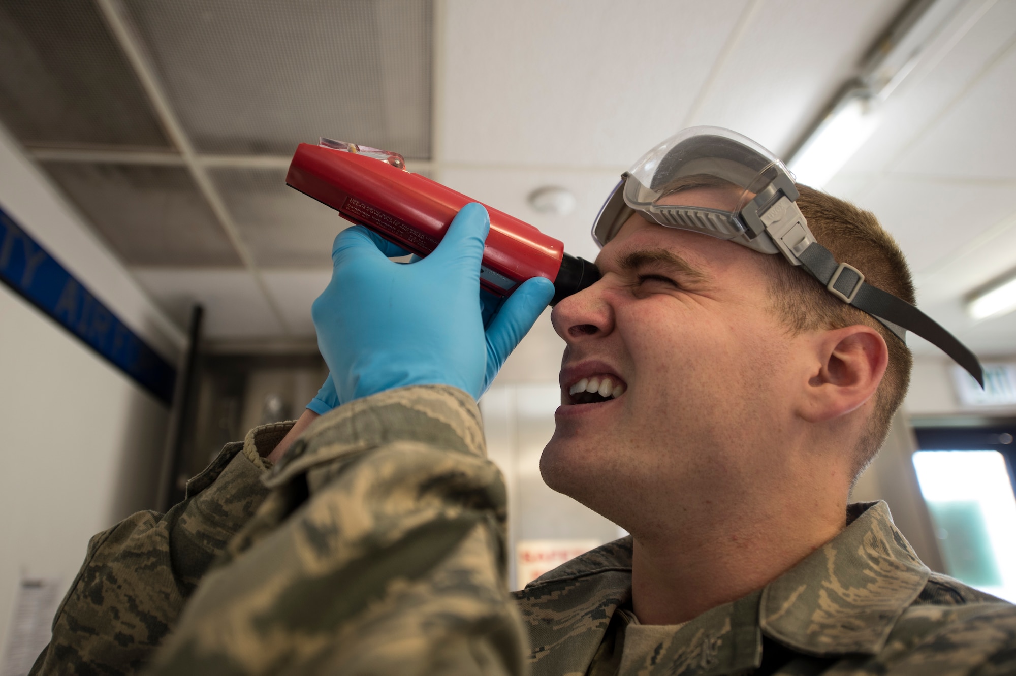 U.S. Air Force Senior Airman Alex Keely, a 52nd Logistics Readiness Squadron fuels laboratory technician, reads a fuel system icing inhibitor test result using a refractometer at Spangdahlem Air Base, Germany, Feb. 16, 2016. The fuels lab ensures jet fuel is properly mixed and free of contaminants before it is used by any Air Force aircraft. (U.S. Air Force photo by Staff Sgt. Christopher Ruano/Released)