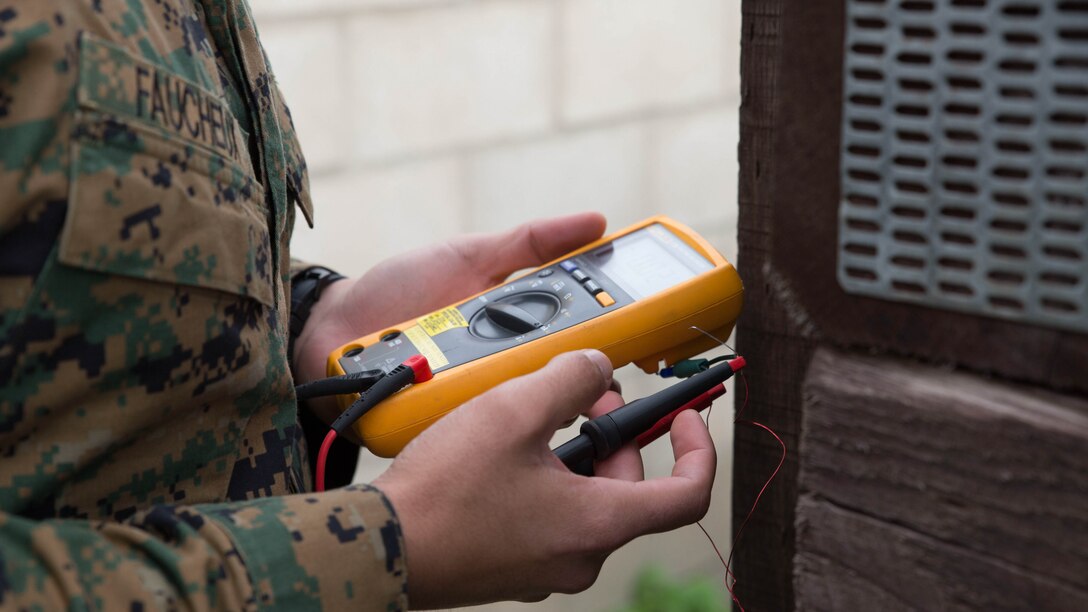A U.S. Marine Corps explosive ordnance disposal technician with Special-Purpose Marine Air-Ground Task Force Crisis Response-Africa sets up a mock improvised explosive device aboard Naval Station Rota, Spain, Feb. 5, 2016. The EOD technicians conducted advanced Improvised Explosive Device and hand entry training to maintain advanced training standards and enhance unit readiness. 