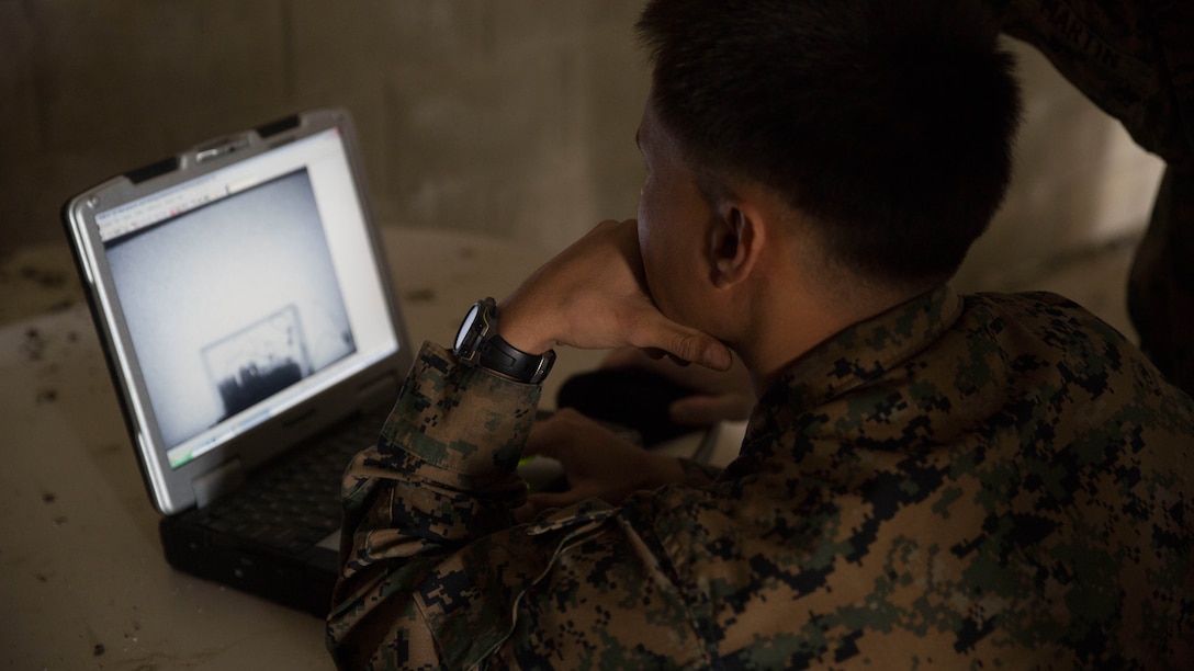 A U.S. Marine Corps explosive ordnance disposal technician with Special Purpose Marine Air-Ground Task Force Crisis Response-Africa examines an X-ray image to analyze the contents of a mock improvised explosive device aboard Naval Station Rota, Spain, Feb. 5, 2016. The EOD technicians conducted advanced Improvised Explosive Device and hand entry training to maintain advanced training standards and enhance unit readiness.