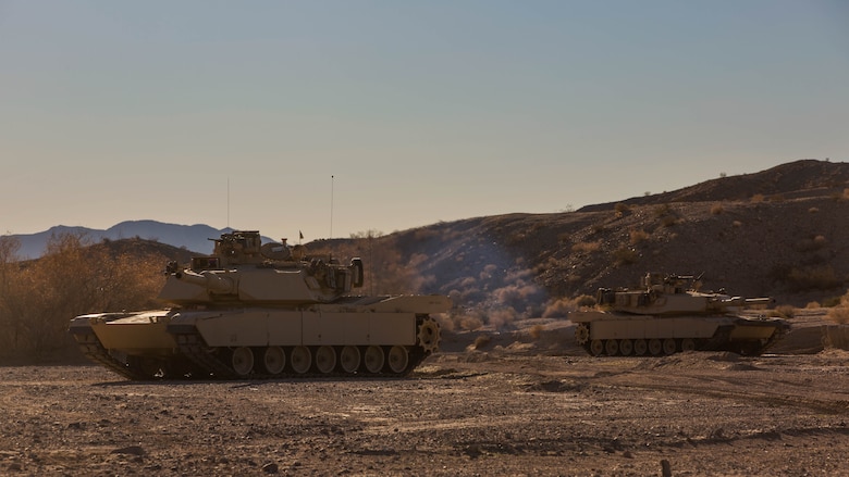 Two M1A1 Abrams Main Battle Tanks with Company A, 1st Tank Battalion,  post security along a road during a Tank Mechanized Assault Course as part of Integrated Training Exercise 2-16 in the Quackenbush Training Area at Marine Corps Air Combat Center Twentynine Palms, Calif. Feb. 9, 2016. ITX is designed to prepare units for combat, under the most realistic conditions possible, focusing on battalion and squad level training. 