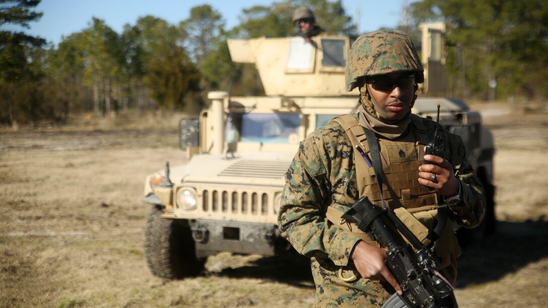 Staff Sgt. Christian T. Todd, a platoon sergeant and assistant convoy commander with Combat Logistics Battalion 6, calls his convoy on the radio during an exercise at Marine Corps Base Camp Lejeune, N.C., Feb. 11, 2016. The Marines encountered opposing forces during the convoy and faced both small arms and indirect fire. 