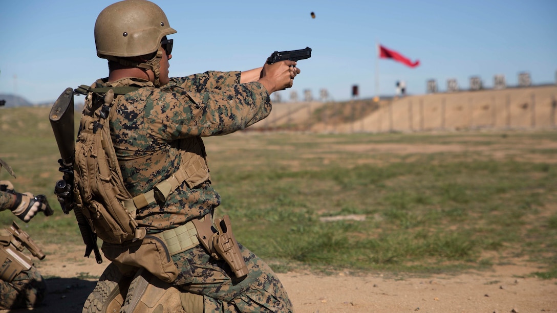 Sgt. Jesus Orozco, the Enhanced Area Canvasing chief with the 12th Marine Corps District in San Diego, Calif., fires his M9 service pistol during the “Gunner’s Match” at the Depot Competition-In-Arms Program aboard Marine Corps Base Camp Pendleton, Calif., Feb. 11, 2016. The DCIAP is a 10-day-long intramural shooting competition that serves as the initial stage of identifying Marines and sailors with the skills and desire to be part of the Marine Corps Recruit Depot’s shooting team.