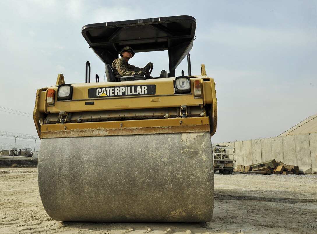 Air Force Staff Sgt. William Schmit operates a steamroller while building the foundation for a new road on Bagram Airfield, Afghanistan, Feb. 9, 2016. Schmit is assigned to the 455th Expeditionary Civil Engineers Squadron. Air Force photo by Tech. Sgt. Nicholas Rau