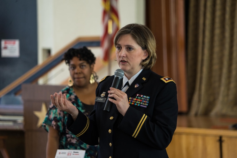 Lt. Col. Bettina Avent, 79th Sustainment Support Command, shares her feelings about losing a close friend in combat and shows her gratitude to the families at a Valentine's Day event for American Gold Star Families in Long Beach, Calif., Feb. 13, 2016.