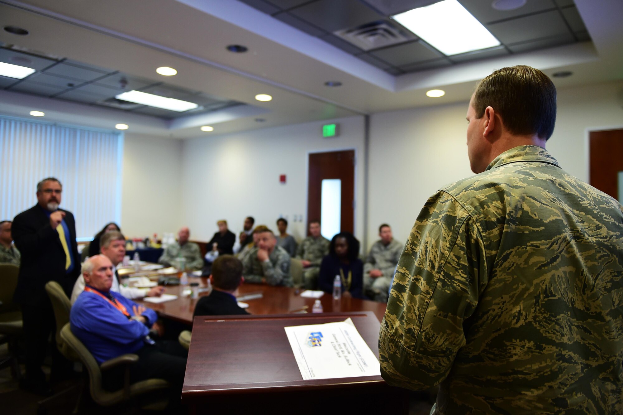 Brig. Gen. Cameron Holt, Air Force Installation Contracting Agency commander, answers questions during a town hall and career perspective brief Feb. 12, 2016, on Buckley Air Force Base, Colorado. The AFICA leader touched base with members to gain insight about daily operations, share words of wisdom and clarify mission projection. (U.S. Air Force photo/Senior Airman Racheal E. Watson/Released)