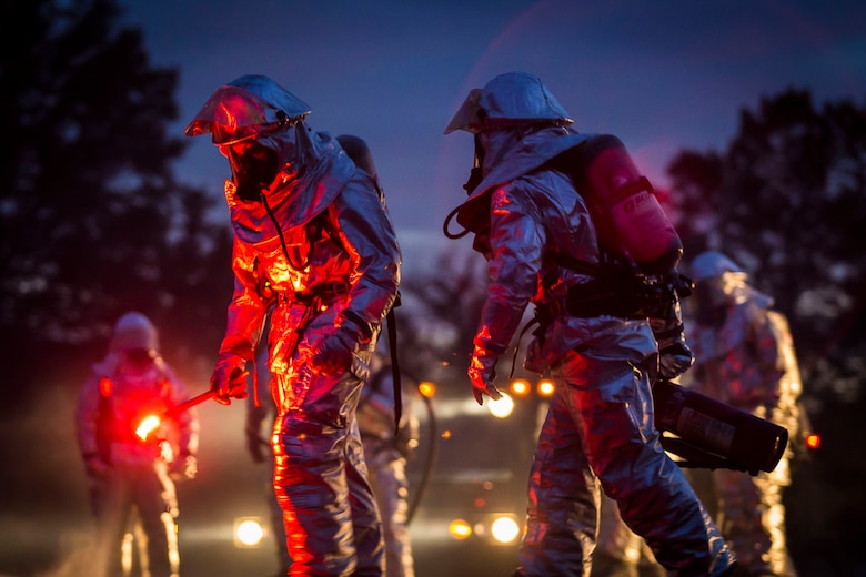 Marines prepare to light the fire during a controlled burn training exercise aboard Marine Corps Air Station Beaufort Feb. 17. The exercise utilized burning jet fuel around a model jet to give Marines a realistic experience of putting out an aircraft fire. The Marines are with Aircraft Rescue and Firefighting. (U.S. Marine Corps Photo by Lance Cpl. Jonah Lovy/Released)