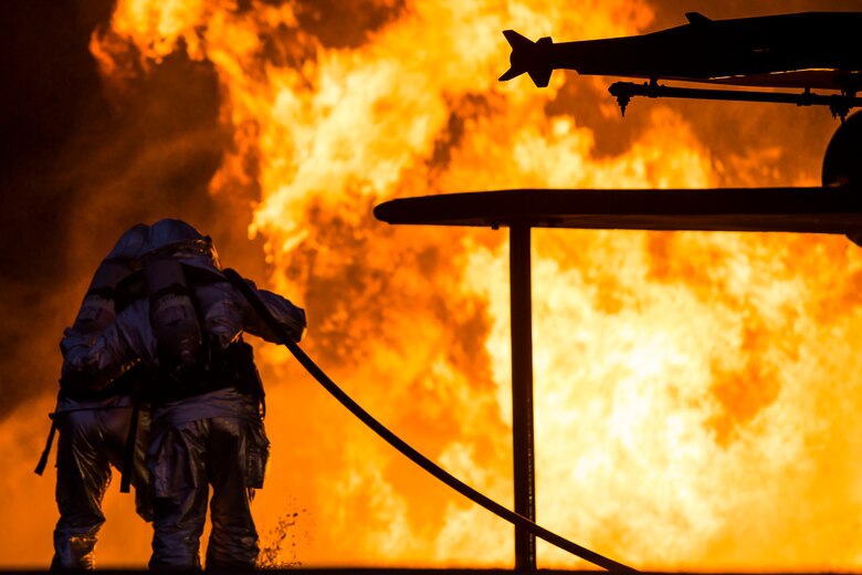 Marines extinguish a fire during a controlled burn training exercise aboard Marine Corps Air Station Beaufort Feb. 17. The Marines with Aircraft Rescue and Firefighting are trained to be ready to respond for an emergency within three minutes. The Marines are with ARFF. (U.S. Marine Corps Photo by Lance Cpl. Jonah Lovy/Released)

