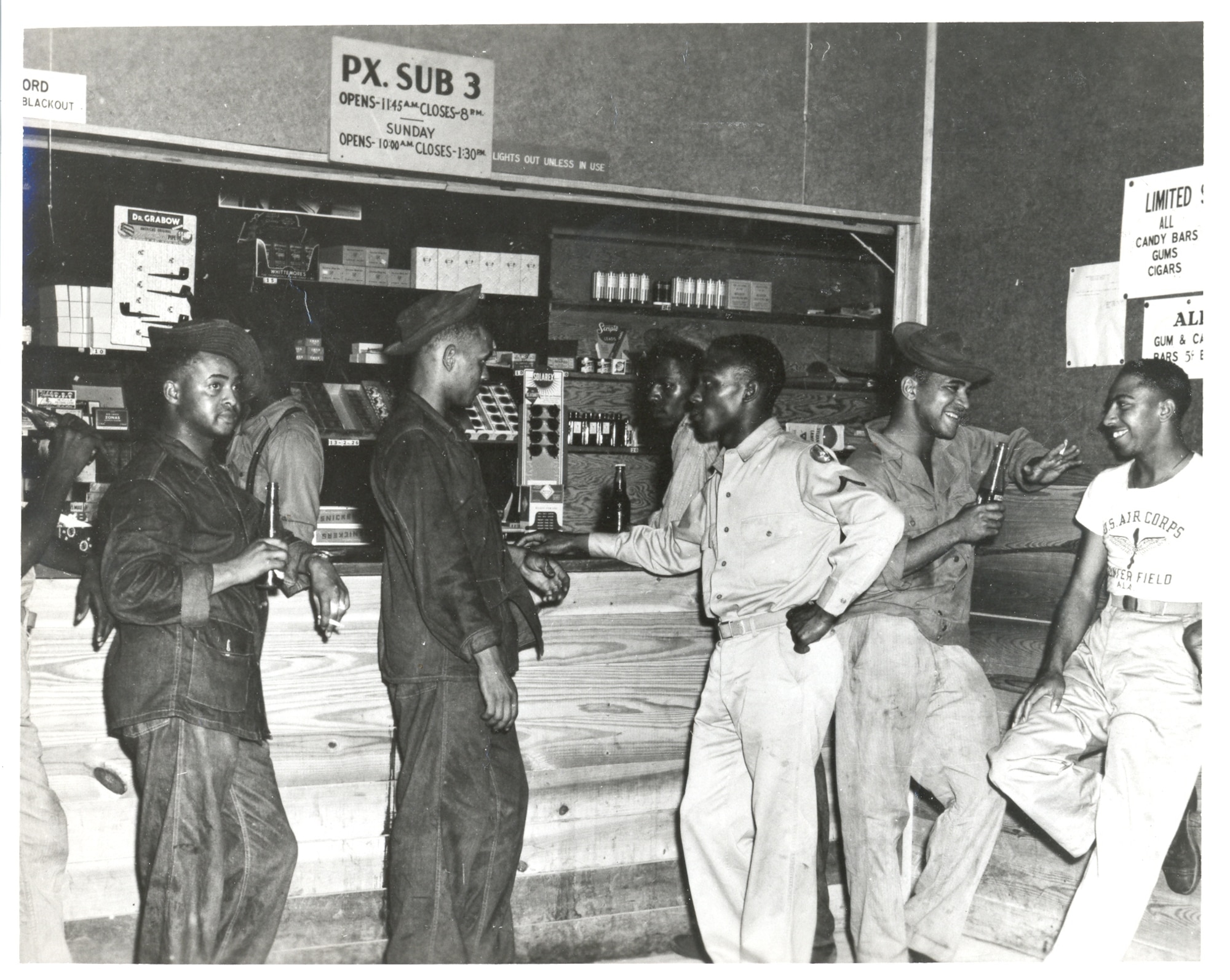 African Americans soldiers assigned to the 4th Aviation Squadron at
Maxwell Field and the 22nd Aviation Squadron at Gunter Field enjoy some off-duty time in the segregated post exchange at Gunter Field, during World War II, 1944.  Units remained segregated until July 1948, when President Harry S. Truman signed the Executive Order 9981 integrating the U.S. military services.  (Courtesy photo U.S. Air Force)

