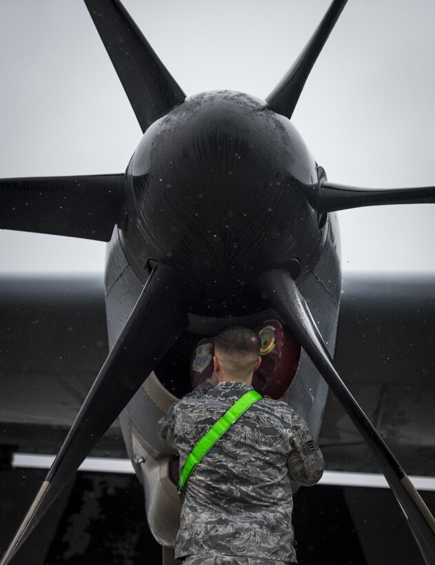 Air Force Senior Airman Jeffrey Erdman conducts a pre-flight inspection on a C-130J Super Hercules aircraft on Pope Army Airfield, N.C., Feb. 4, 2016. Erdman is a crew chief assigned to the 19th Aircraft Maintenance Squadron. Air Force photo by Staff Sgt. Marianique Santos