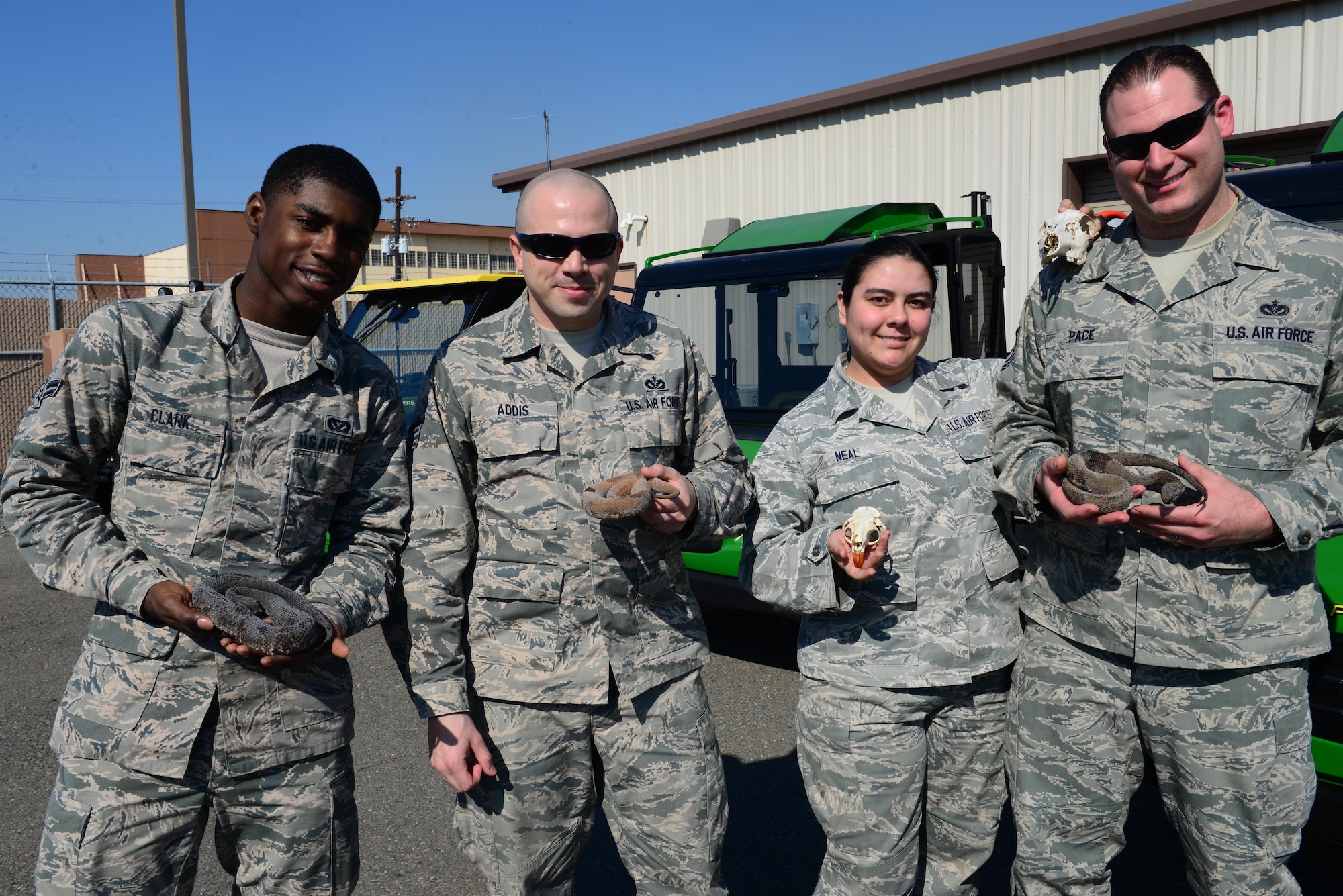 Airmen from the 2nd Civil Engineer Squadron pest management pose for a photo at Barksdale Air Force Base, La., Feb. 12, 2016. Pest management Airmen work with all sorts of animals to make sure Barksdale’s work environment is safe. (U.S. Air Force Photo/Airman 1st Class Luke Hill)