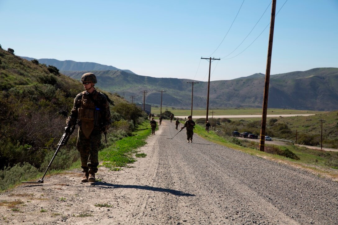 Lance Cpl. Scott Bone sweeps for possible IEDs with a compact metal detector during counter-IED training at Camp Pendleton, Feb. 12, 2016. This training is a part of a new Counter-IED Training Class developed by the Marine Corps Engineer School, Defeat the Device Branch, to improve operational readiness. Bone is a combat engineer with Company A, 1st Combat Engineer Battalion, 1st Marine Division.