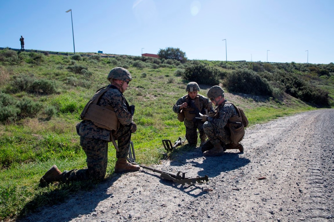 U.S. Marines call in for Explosive Ordnance Disposal technicians after discovering a possible IED during counter-IED training at Camp Pendleton, Feb. 12, 2016. The Marines were testing out the pilot course of Marine Corps Engineer School, Defeat the Device branch, Counter-IED Training Class. The Marines participating in the training are with Company A, 1st Combat Engineer Battalion, 1st Marine Division.