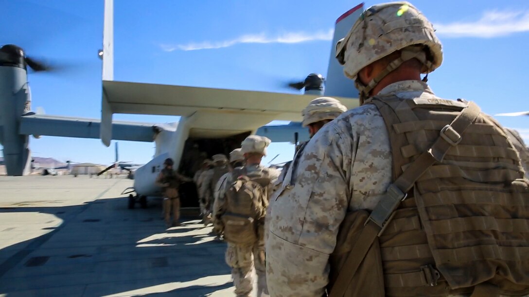 Marines and Sailors with Company F, 2nd Battalion, 7th Marine Regiment, 1st Marine Division, load an MV-22B Osprey during tactical recovery of aircraft and personnel training aboard Marine Corps Air Ground Combat Center Twentynine Palms, Calif., Feb. 4, 2016. The training will better prepare 2/7 for their upcoming deployment to the Central Command area of responsibility as the ground combat element for Special Purpose Marine Air Ground Task Force Crisis Response Central Command 16.2, where they will be positioned to conduct TRAP missions in support of Operation Inherent Resolve. (U.S. Marine Corps photo by Cpl. Danielle Rodrigues/Released)