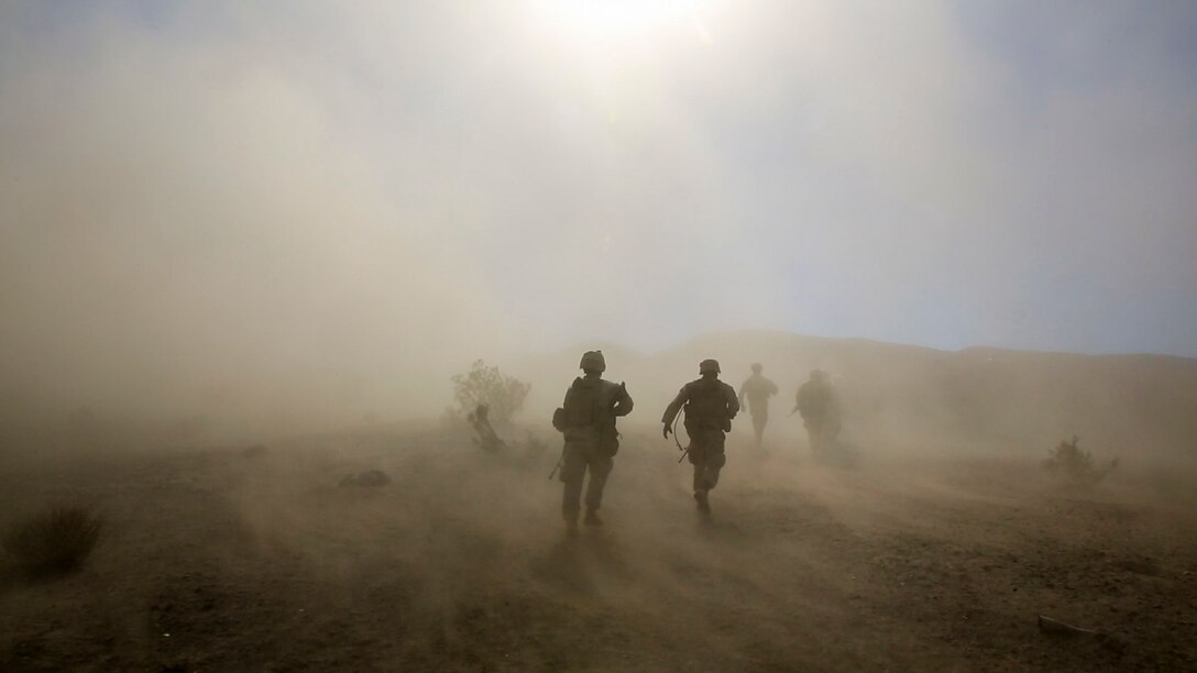 Marines and Sailors with Company F, 2nd Battalion, 7th Marine Regiment, 1st Marine Division, run toward a simulated casualty during tactical recovery of aircraft and personnel training aboard Marine Corps Air Ground Combat Center Twentynine Palms, Calif., Feb. 4, 2016. The training will better prepare 2/7 for their upcoming deployment to the Central Command area of responsibility as the ground combat element for Special Purpose Marine Air Ground Task Force Crisis Response Central Command 16.2, where they will be positioned to conduct TRAP missions in support of Operation Inherent Resolve. (U.S. Marine Corps photo by Cpl. Danielle Rodrigues/Released)