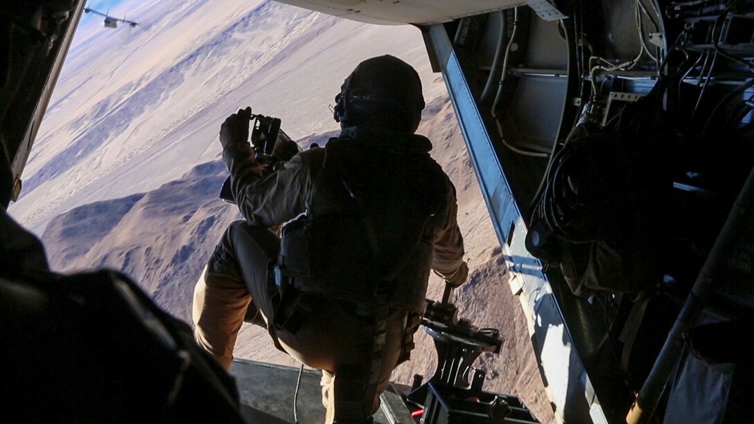 A Marine with Marine Medium Tiltrotor Squadron 363, 3rd Marine Aircraft Wing, provides security on an MV-22B Osprey as Marines and Sailors with Company F, 2nd Battalion, 7th Marine Regiment, 1st Marine Division, conduct a tactical recovery of aircraft and personnel training mission aboard Marine Corps Air Ground Combat Center Twentynine Palms, Calif., Feb. 4, 2016. The training will better prepare 2/7 and VMM-363 for their upcoming deployment to the Central Command area of responsibility as elements of Special Purpose Marine Air Ground Task Force Crisis Response Central Command 16.2, where they will be positioned to conduct TRAP missions in support of Operation Inherent Resolve. (U.S. Marine Corps photo by Cpl. Danielle Rodrigues/Released)