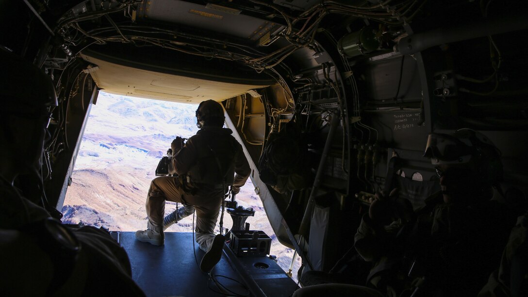 A Marine with Marine Medium Tiltrotor Squadron 363, 3rd Marine Aircraft Wing, provides security on an MV-22B Osprey as Marines and Sailors with Company F, 2nd Battalion, 7th Marine Regiment, 1st Marine Division, conduct a tactical recovery of aircraft and personnel training mission aboard Marine Corps Air Ground Combat Center Twentynine Palms, Calif., Feb. 4, 2016. The training will better prepare 2/7 and VMM-363 for their upcoming deployment to the Central Command area of responsibility as elements of Special Purpose Marine Air Ground Task Force Crisis Response Central Command 16.2, where they will be positioned to conduct TRAP missions in support of Operation Inherent Resolve. (U.S. Marine Corps photo by Cpl. Danielle Rodrigues/Released)
