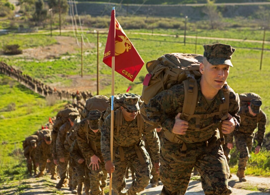 Marines trudge up a steep hill for a six-mile conditioning hike Feb. 12, 2016, at Camp Pendleton, Calif. The six-mile hike, held by I Marine Expeditionary Force Headquarters Group, sought to improve operational readiness and build camaraderie through tough, realistic physical training. These Marines are with I MHG Combat Service Support Company. (U.S. Marine Corps photo by Lance Cpl. Justin E. Bowles)