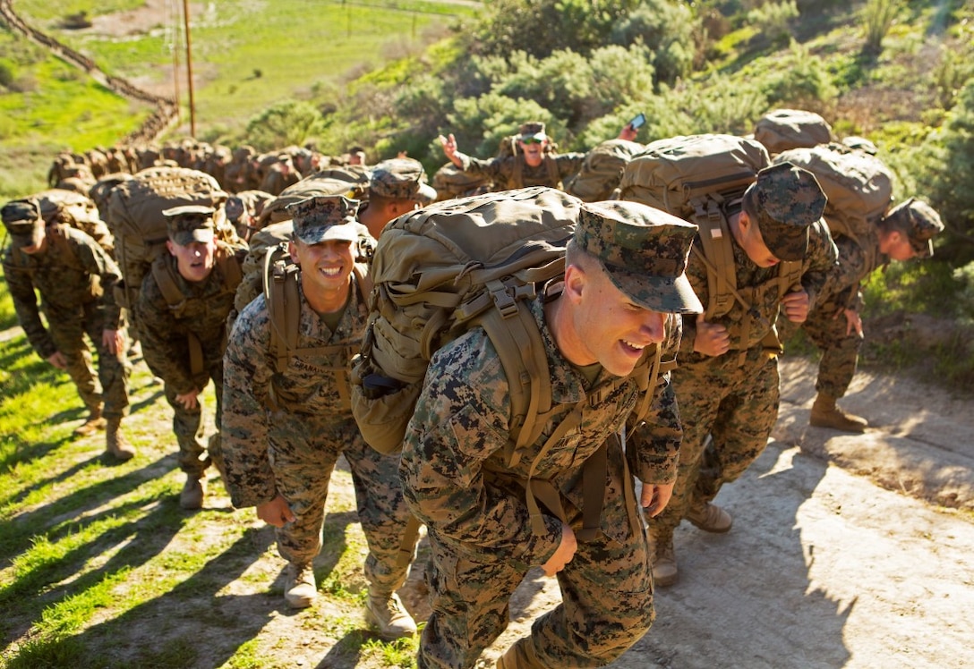 Marines from I Marine Expeditionary Force Headquarters Group trek up a steep hill for a six-mile conditioning hike Feb. 12, 2016, at Camp Pendleton, Calif. The six-mile hike sought to improve operational readiness and build camaraderie through tough, realistic physical training. (U.S. Marine Corps photo by Lance Cpl. Justin E. Bowles)