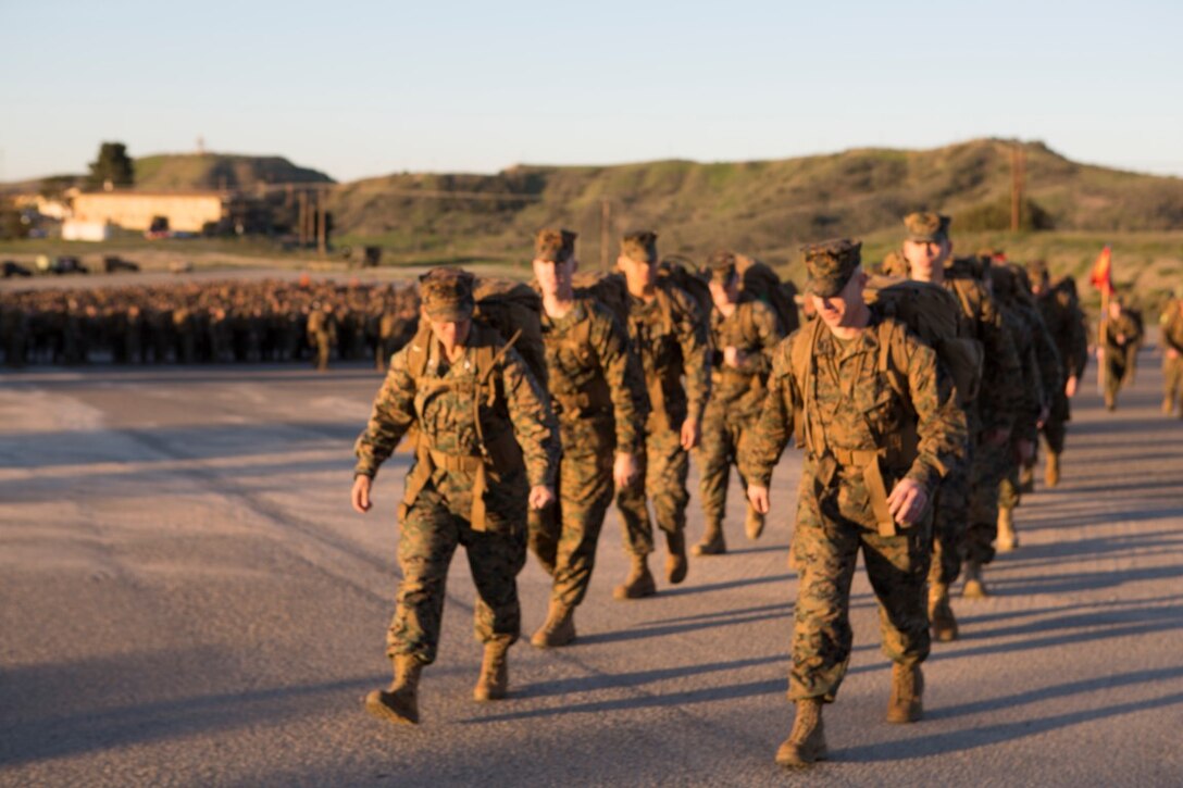 Col. Roberta L. Shea and Sgt. Maj. David A. Wilson lead I Marine Expeditionary Force Headquarters Group on a conditioning hike Feb. 12, 2016, at Camp Pendleton, Calif. The six-mile hike sought to improve operational readiness and build camaraderie through tough, realistic physical training. “I believe conditioning hikes are a remarkable opportunity for units to demonstrate not only morale and unit cohesion but, most importantly, small unit leadership,” said Shea, the commanding officer of I MHG, I Marine Expeditionary Force. (U.S. Marine Corps photo by Lance Cpl. Justin E. Bowles)