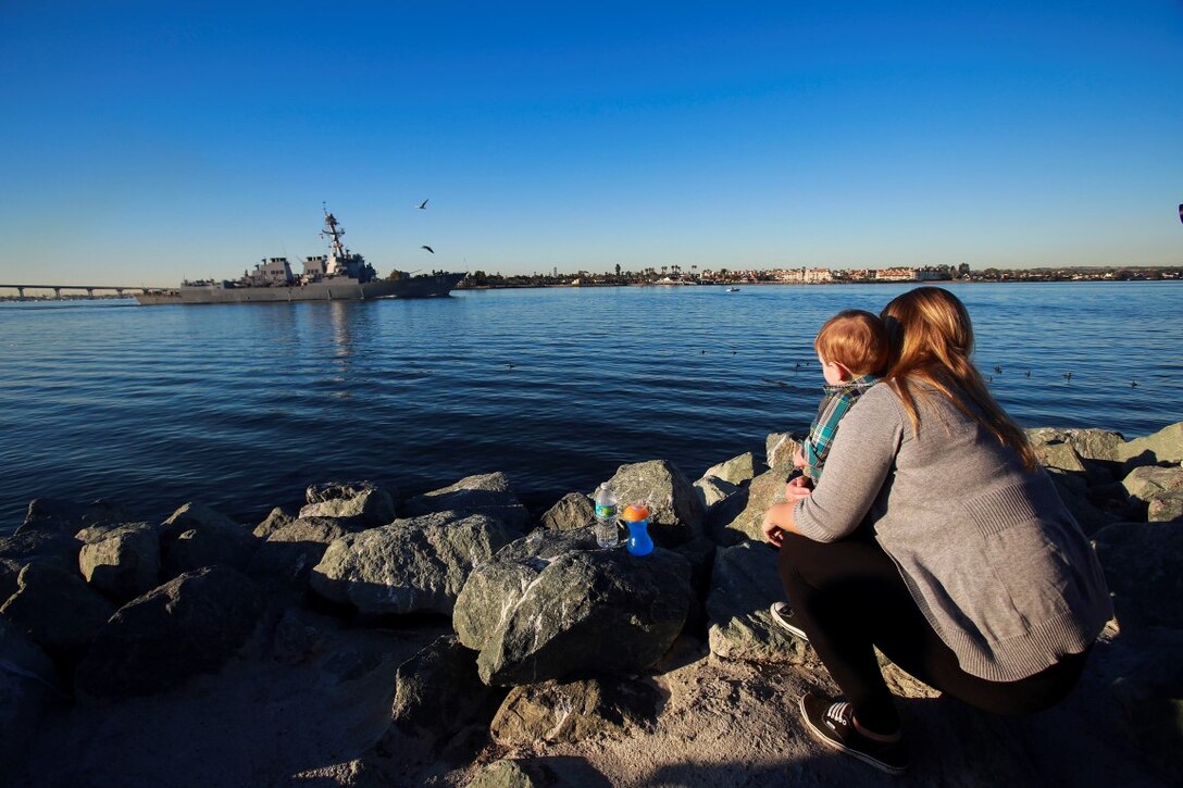 Courtney Trump watches the approach of the USS Harpers Ferry during the departure of the 13th Marine Expeditionary Unit from San Diego Feb. 12, 2016. Her husband, Lance Cpl. Dominic Trump from Hamburg, Pa., a motor transportation operator, deployed with the 13th MEU as part of the Battalion Landing Team, 2nd Battalion, 1st Marine Regiment, I Marine Expeditionary Force. The 13th MEU is capable of conducting amphibious operations, crisis response and limited contingency operations and is beginning an estimated six-month deployment to the Western Pacific and Middle East. (U.S. Marine Corps photo by Lance Cpl. Caitlin Bevel)