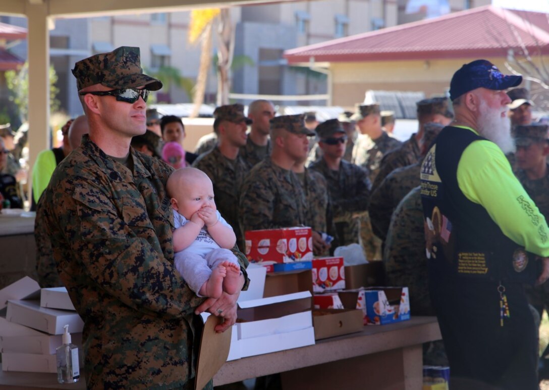 Master Sgt. Matthew Small, from Hampton, Massachusetts, stands with his child on their last day together at Camp Pendleton Feb. 11, 2016. Matthew is an explosive ordnance disposal technician with Combat Logistics Battalion 13. He is set to deploy with the 13th Marine Expeditionary Unit to the Western Pacific and the Middle East. (U.S. Marine Corps photo by Cpl. John Baker)