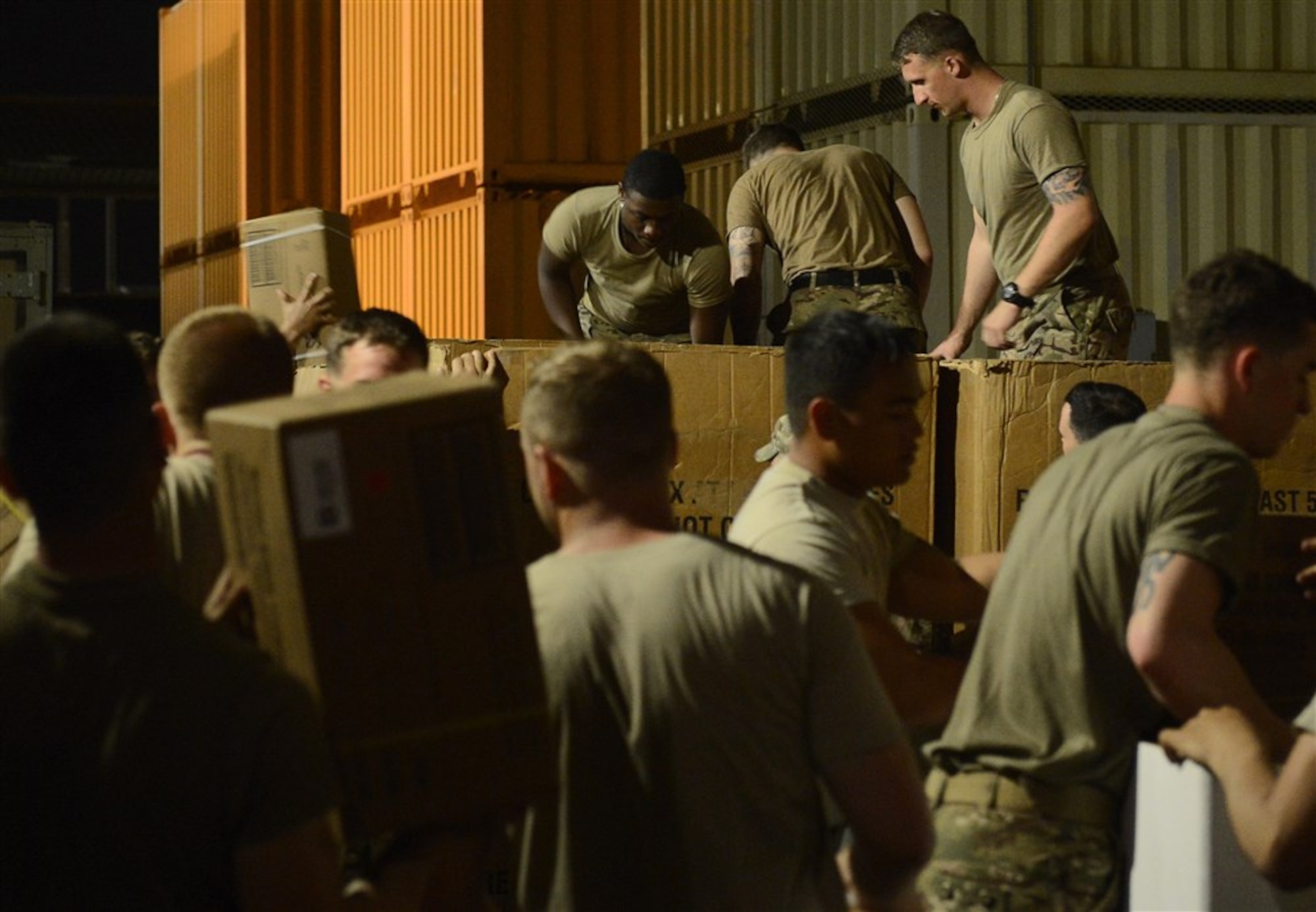 Soldiers from Bravo Company, 3rd Battalion, 15th Infantry Regiment, load pallets with water and meals ready-to-eat Feb. 13, 2016, at Camp Lemonnier, Djibouti. Members of Bravo Company participated in a two-part validation exercise that consisted of a rapid mobilization scenario from the camp, which lead to the company convoying to and providing security for the U.S. Embassy in Djibouti. (U.S. Air Force photo by Senior Airman Peter Thompson)
