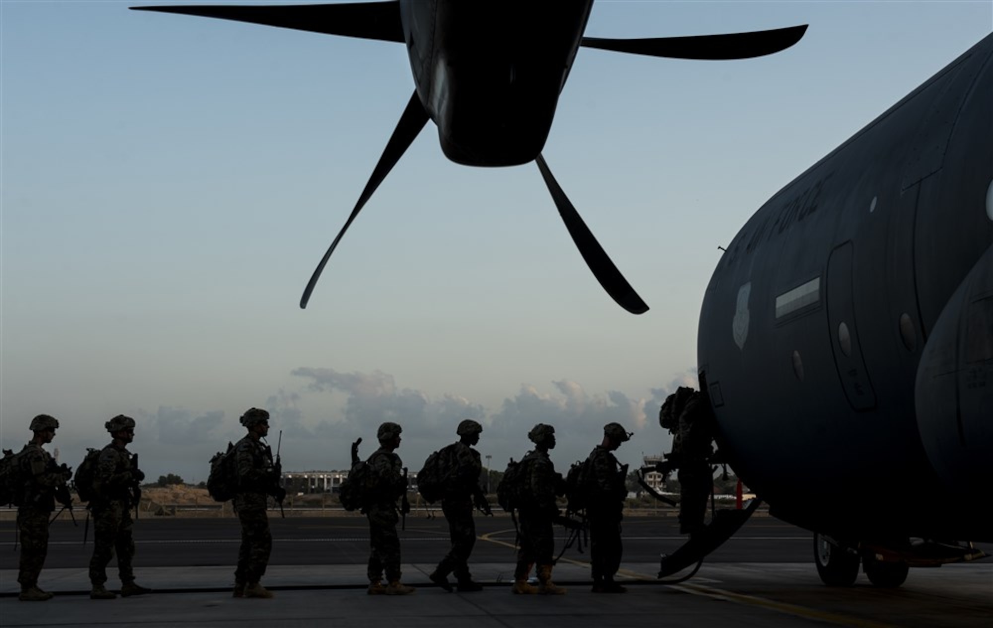 Soldiers from Bravo Company, 3rd Battalion, 15th Infantry Regiment, board a C-130J Super Hercules assigned to the 75th Expeditionary Airlift Squadron Feb. 13, 2016, at Camp Lemonnier, Djibouti. Members of the U.S. Army’s Bravo Company 3-15, from Fort Stewart, Georgia, completed a validation exercise displaying their ability to assume responsibility from Alpha Company 3-15, as the East Africa Response Force assigned to Combined Joint Task Force-Horn of Africa. (U.S. Air Force photo by Senior Airman Peter Thompson)
