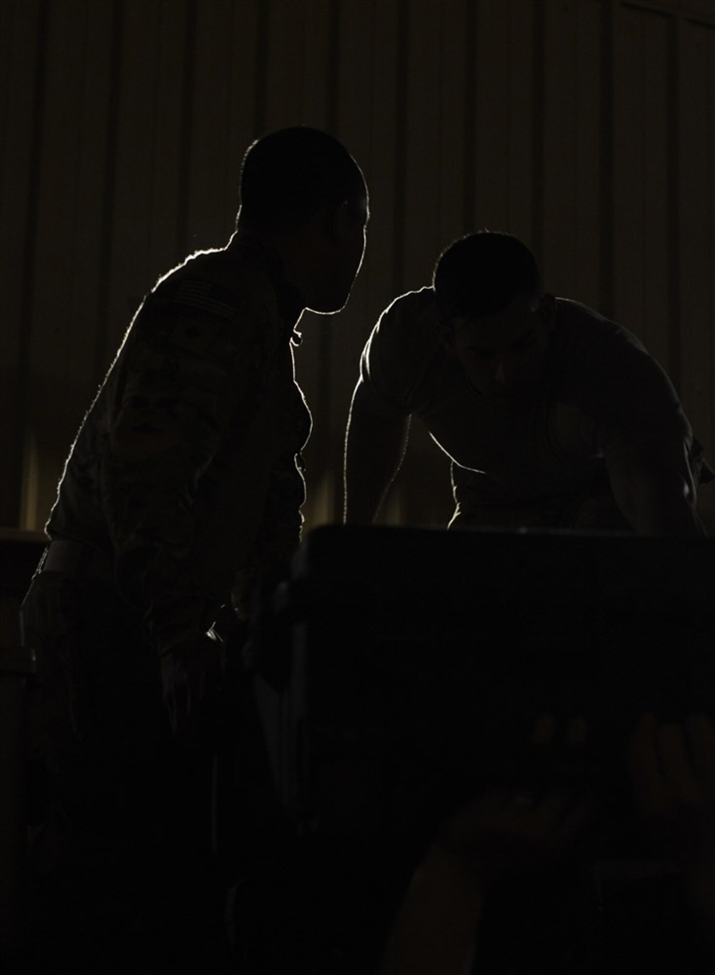 Soldiers from Bravo Company, 3rd Battalion, 15th Infantry Regiment, load pallets with water and meals ready-to-eat Feb. 13, 2016, at Camp Lemonnier, Djibouti. After being recalled in the early hours of the morning to validate the East Africa Response Force’s rapid response ability, EARF members gathered and immediately began by prepping personal gear and equipment. Shortly after, teams began building pallets with all the necessities for self-sustainment and mission accomplishment. (U.S. Air Force photo by Senior Airman Peter Thompson)