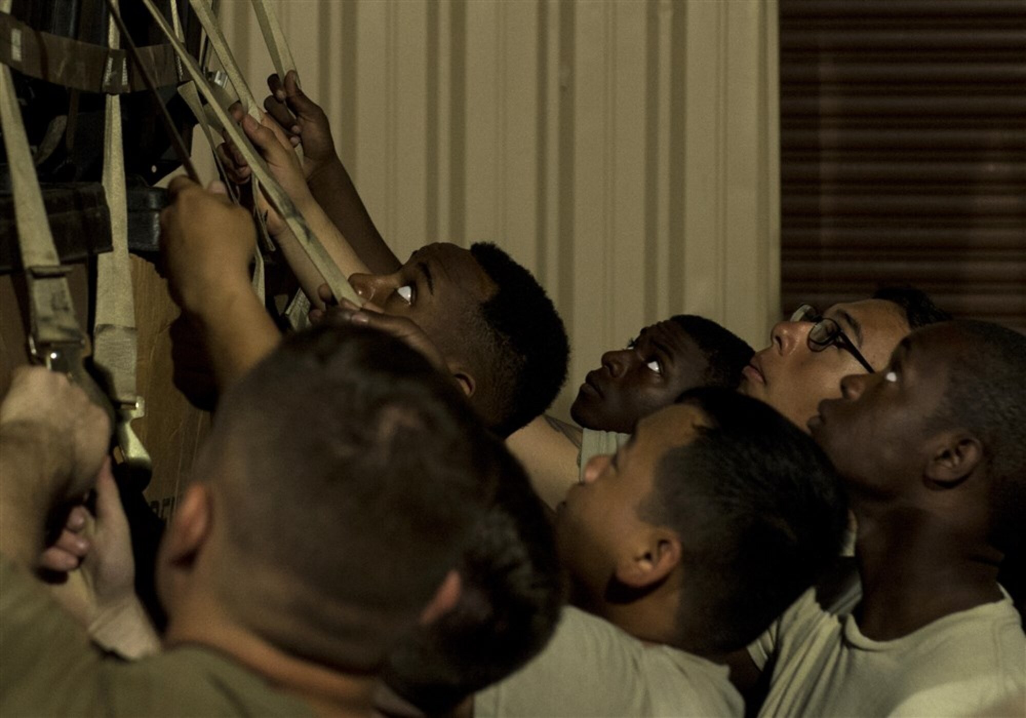 Soldiers from Bravo Company, 3rd Battalion, 15th Infantry Regiment, listen for the order to pull while securing equipment to a pallet Feb. 13, 2016, at Camp Lemonnier, Djibouti. The East Africa Response Force serves as a part of U.S. Africa Command’s crisis response capability, and is tasked with responding to emergency situations at U.S. Embassies in the East African region or in countries around the CJTF-HOA area of responsibility. (U.S. Air Force photo by Senior Airman Peter Thompson)