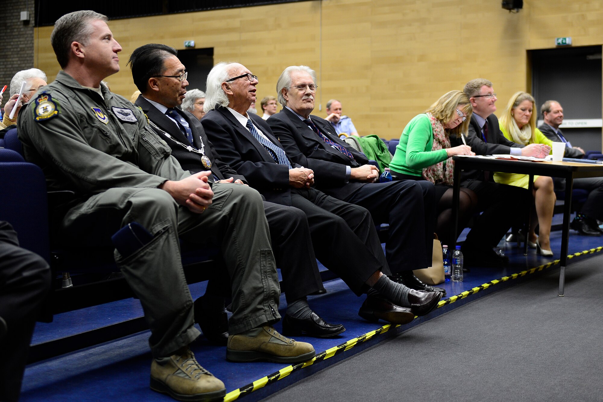Col. David Eaglin, 48th Fighter Wing vice commander, and distinguished guests from the surrounding community sit in the audience of the English-Speaking Union debate, at Royal Air Force Lakenheath, England, Feb. 11, 2016. Councillor Robert Everett and Col. Robert Novotny, 48th Fighter Wing commander, coordinated to have the debate held on the installation to further strengthen the bond between the American and British communities. (U.S. Air Force photo by Airman 1st Class Erin R. Babis/Released)