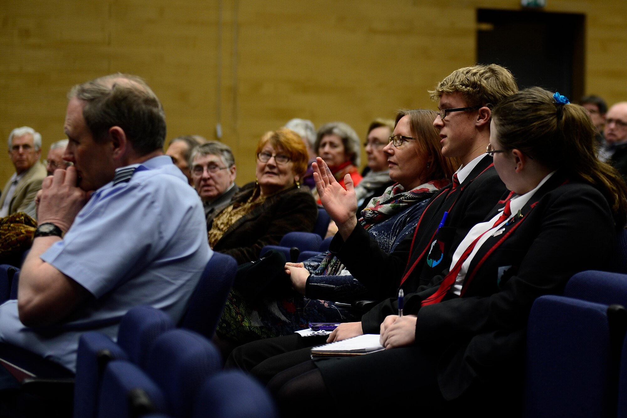 An audience member asks questions to the debate teams during the English-Speaking Union debate at Royal Air Force Lakenheath, England, Feb. 11, 2016. Councillor Robert Everitt, former Mayor of St Edmundsbury and Col. Robert Novotny, 48th Fighter Wing commander, coordinated to have the debate held on the installation to further strengthen the bond between the American and British communities. (U.S. Air Force photo by Airman 1st Class Erin R. Babis/Released)