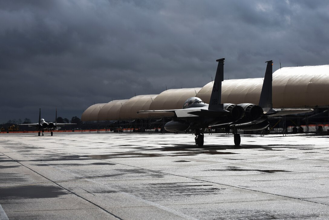Two F-15E Strike Eagles taxi to the flightline, Feb. 16, 2016, at Seymour Johnson Air Force Base, North Carolina. More than 30 spouses from the 335th Fighter Squadron and 4th Aircraft Maintenance Squadron got the opportunity to see the aircraft up close and personal and received taxi rides around the runway. (U.S. Air Force/Airman Shawna L. Keyes)