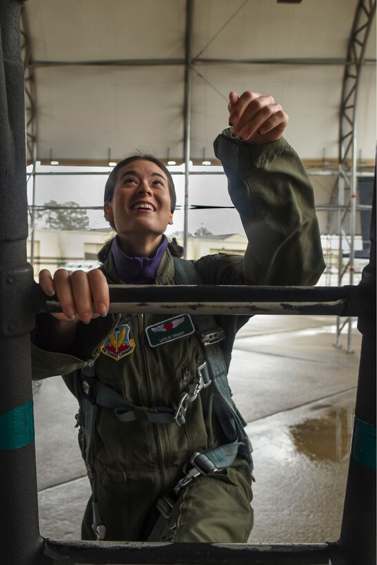 Leslie Wight, wife of Capt. Taylor Wight, 335th Fighter Squadron pilot, climbs a ladder of an F-15E Strike Eagle, Feb. 16, 2016, at Seymour Johnson Air Force Base, North Carolina. Spouses were taxied around the runway in an F-15E Strike Eagle to experience a day in the life of both air and ground crews. (U.S. Air Force photo/Airman Shawna L. Keyes)
