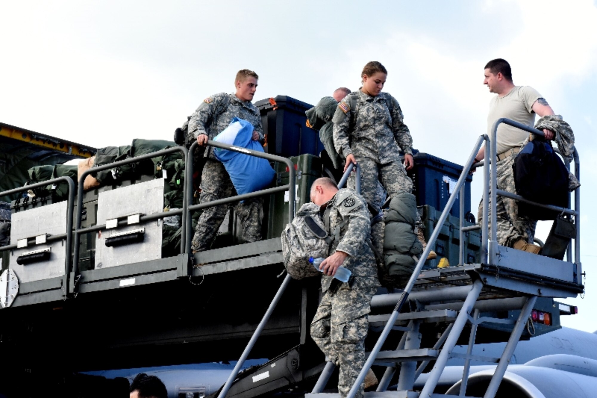 Soldiers of the 1434th Engineer Company, 101st Battalion of the Michigan Army National Guard deplaned the Michigan Air National Guard KC-135 Stratotanker, after landing safely at 156th Airlift Wing, Muñiz Air National Guard Base, Puerto Rico, Feb. 10, 2016. The 127th Wing was providing transatlantic airlift support to the 1434th Engineer Company, who had completed a 30-day humanitarian deployment in Liberia, Africa, when the KC-135 experienced engine trouble and obligated the KC-135 aircrew to divert from their planned route of flight to a strategic location that would secure the safety of the passengers, aircrew and aircraft.
(U.S. Air National Guard photos by Tech. Sgt. Marizol Ruiz /Released)
