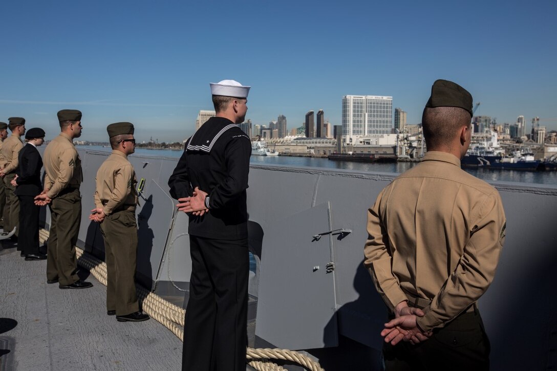 U.S. Marines and Sailors with the 13th Marine Expeditionary Unit man the rails aboard the USS New Orleans as they depart San Diego, California, February 12, 2016. The Boxer Amphibious Ready Group and the 13th MEU will be operating in the Pacific and central Commands area of responsibilities during their western pacific deployment 16-1. (U.S. Marine Corps photo by Sgt. Tyler C. Gregory/released)