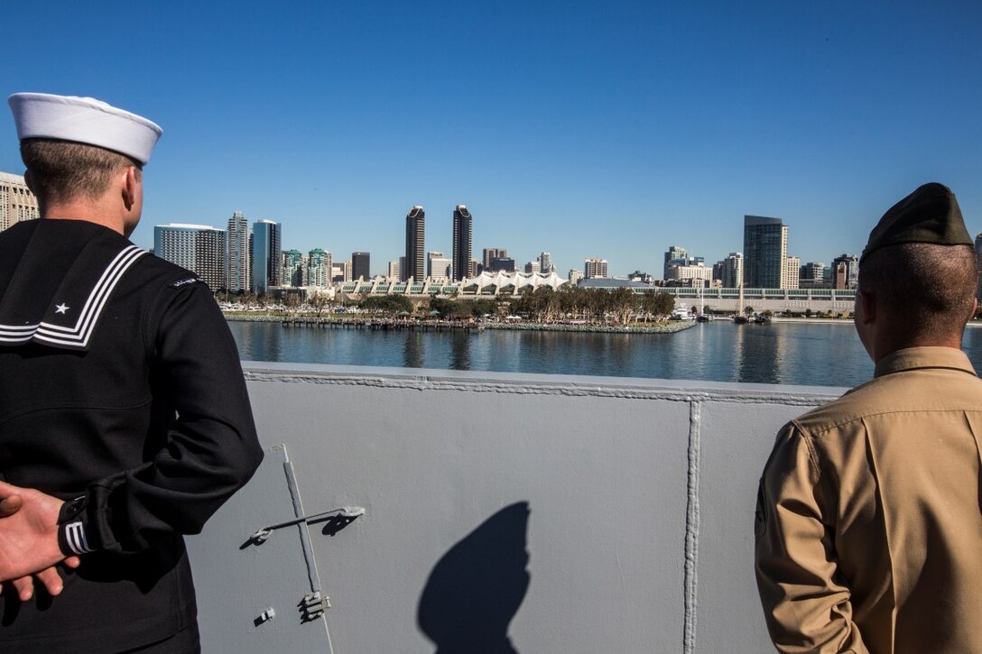 U.S. Marines and Sailors with the 13th Marine Expeditionary Unit man the rails aboard the USS New Orleans as they depart San Diego, California, February 12, 2016. The Boxer Amphibious Ready Group and the 13th MEU will be operating in the Pacific and central Commands area of responsibilities during their western pacific deployment 16-1. (U.S. Marine Corps photo by Sgt. Tyler C. Gregory/released)