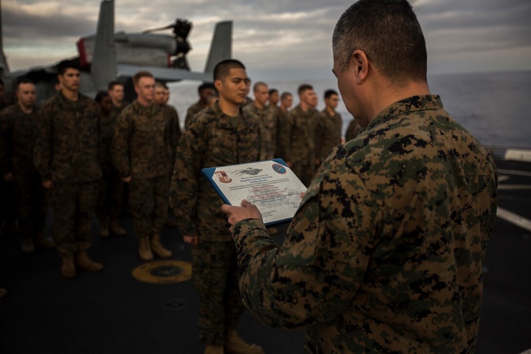 U.S. Navy Hospital Corpsman 3rd Class Nicolas Biscocho with Combat Logistics Battalion 13, Boxer Amphibious Ready Group/13th Marine Expeditionary Unit receives an Enlisted Fleet Marine Force Warfare Specialist Qualification device during a formation aboard the USS New Orleans, February 16, 2016. The device signifies the completion of the Fleet Marine Force Qualification training that Navy Corpsmen take to familiarize themselves with the Marine Corps. (U.S. Marine Corps photo by Sgt. Tyler C. Gregory/released)