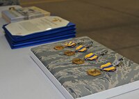 Four Air Force Commendation Medals are presented to 380th Expeditionary Aircraft Maintenance Squadron Airmen during an awards ceremony at an undisclosed location in Southwest Asia, Feb. 16, 2016. Air Force Commendation Medals are awarded to armed services personnel who distinguish themselves by meritorious achievement and service while serving in any capacity with the Air Force. (U.S. Air Force photo by Staff Sgt. Kentavist P. Brackin/Released)