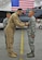 U.S. Air Force 1st Lt. Nicholas, F-15E Strike Eagle fighter pilot assigned to the 391st Expeditionary Fighter Squadron, pins an Air Force Commendation Medal on Senior Airman Nash Camden, a 380th Expeditionary Aircraft Maintenance Squadron weapons load crew member, during an awards ceremony at an undisclosed location in Southwest Asia, Feb. 16, 2016. Nicholas is one of two aircrew members who were inside a taxiing F-15 when a hydraulic fluid leak on the aircraft’s hot brakes set it afire Dec. 2, 2015. (U.S. Air Force photo by Staff Sgt. Kentavist P. Brackin/Released)