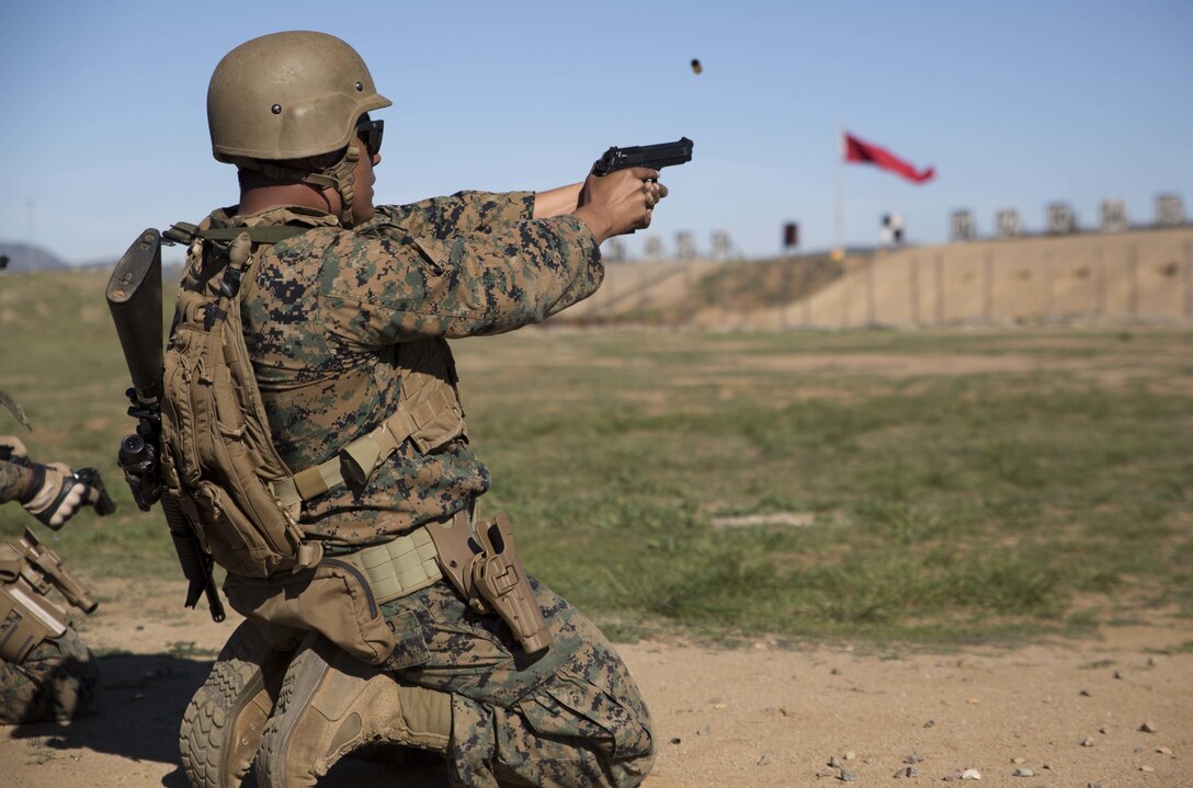 Sgt. Jesus Orozco, the Enhanced Area Canvasing chief with the 12th Marine Corps District in San Diego, Calif., fires his M9 service pistol during the “Gunner’s Match” at the Depot Competition-In-Arms Program aboard Marine Corps Base Camp Pendleton, Calif., Feb. 11, 2016. The DCIAP is a 10-day-long intramural shooting competition that serves as the initial stage of identifying Marines and sailors with the skills and desire to be part of the Marine Corps Recruit Depot’s shooting team.