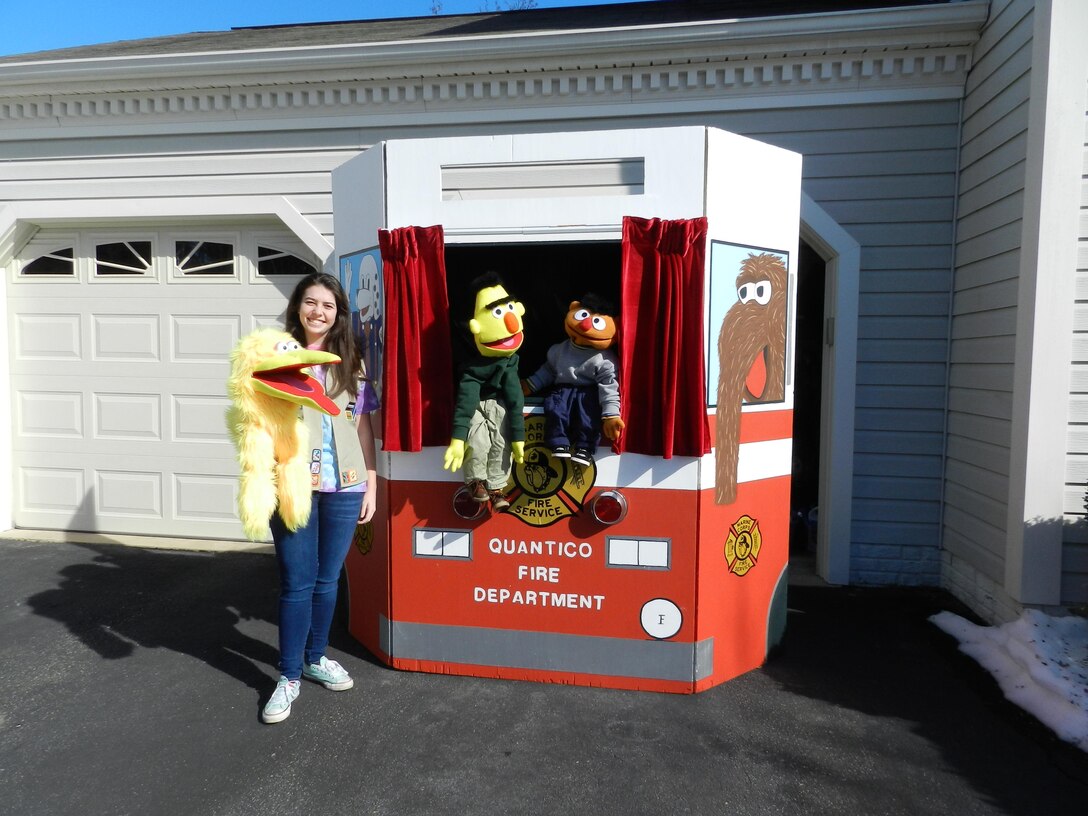 Nicole Carpenter competed her Gold Award for Girl Scouts by refurbishing the stage and recreating puppets for the Quantico Fire and Emergency Services to be used during Fire Safety Month.
