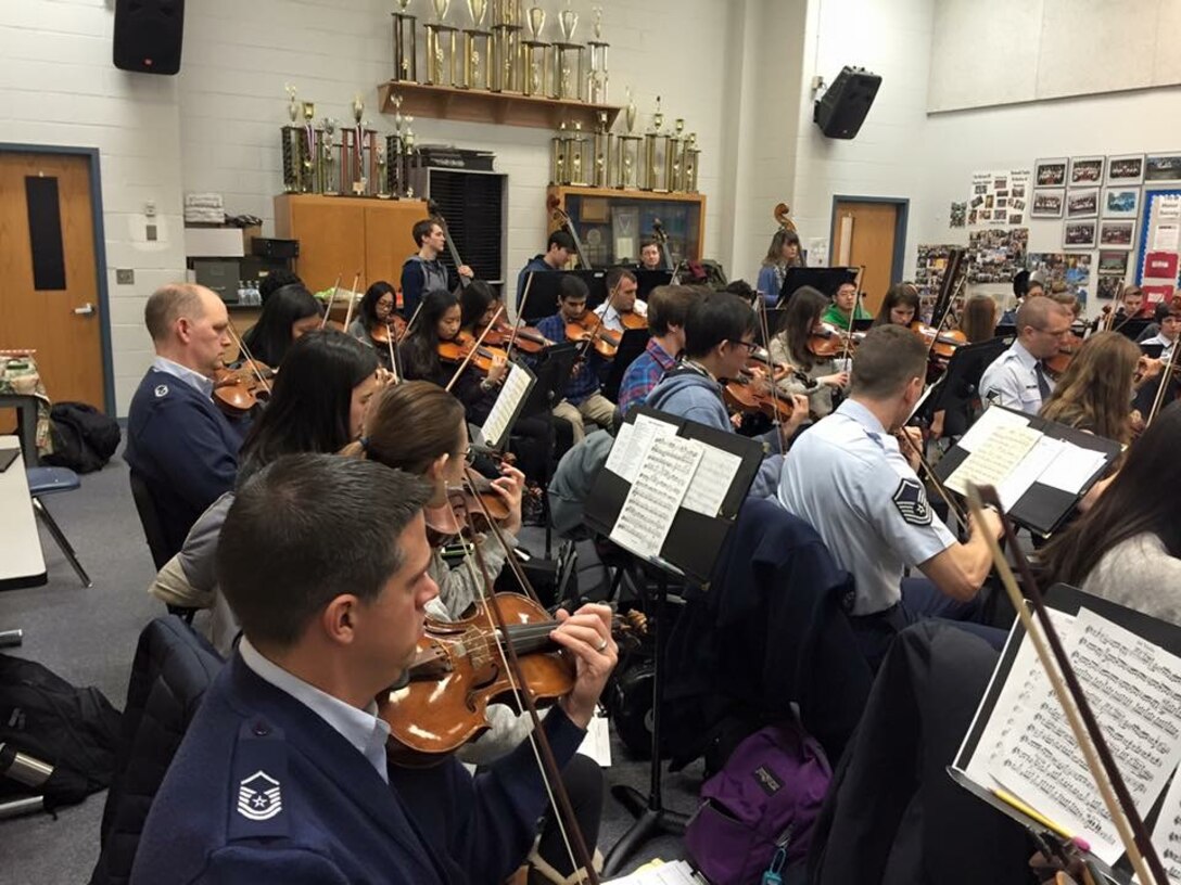 The Air Force Strings spent a morning with students at McLean High School presenting an
Advancing Innovation through Music (AIM) clinic.  They had the opportunity to perform a strolling show and also work with string students during their orchestra rehearsals. (U.S. Air Force Photo/released)
